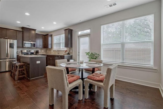 dining room featuring dark wood-type flooring