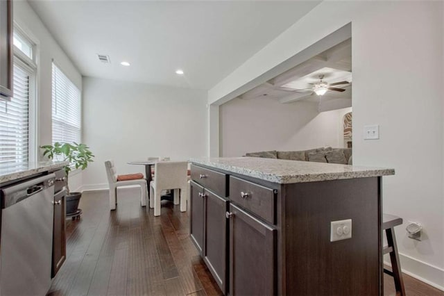 kitchen featuring stainless steel dishwasher, ceiling fan, dark hardwood / wood-style floors, dark brown cabinets, and a kitchen island