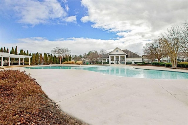 view of swimming pool featuring a patio area