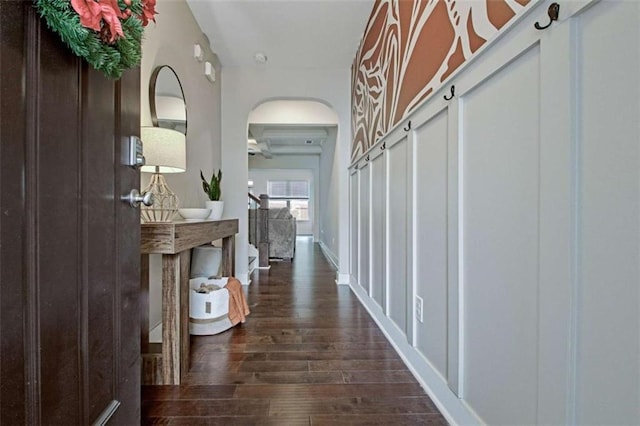 corridor with dark hardwood / wood-style flooring