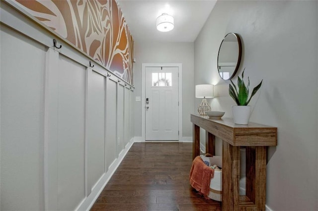 doorway to outside featuring dark wood-type flooring