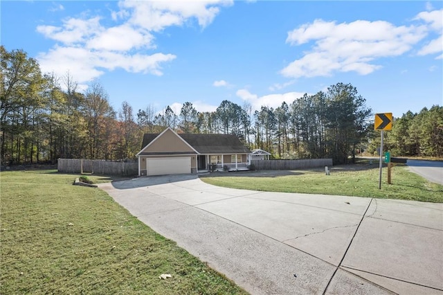 ranch-style house featuring a front lawn and a garage