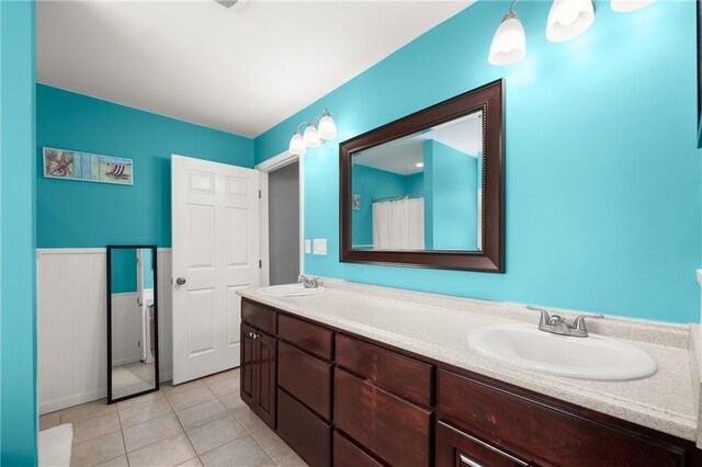 bathroom with vanity and tile patterned floors