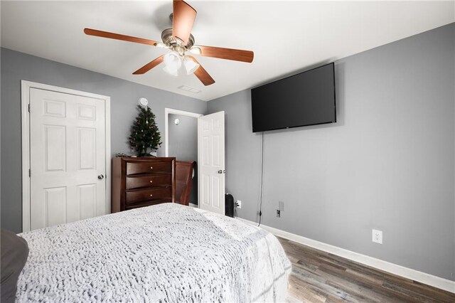 bedroom featuring ceiling fan and dark hardwood / wood-style flooring