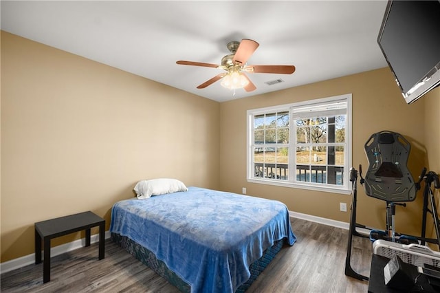 bedroom with ceiling fan and wood-type flooring