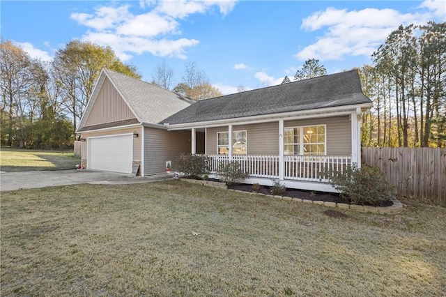 view of front of property featuring a porch, a front yard, and a garage