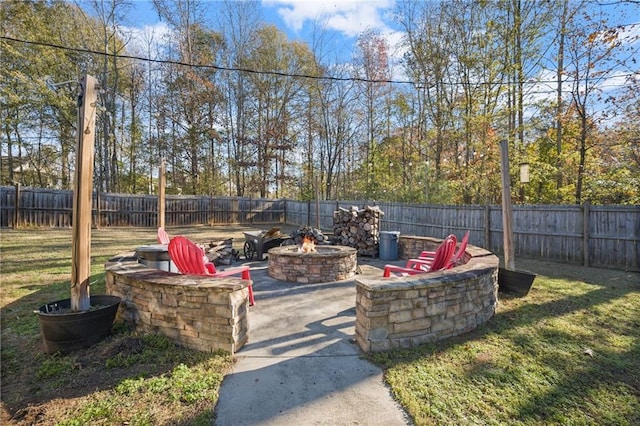 view of patio with a fire pit