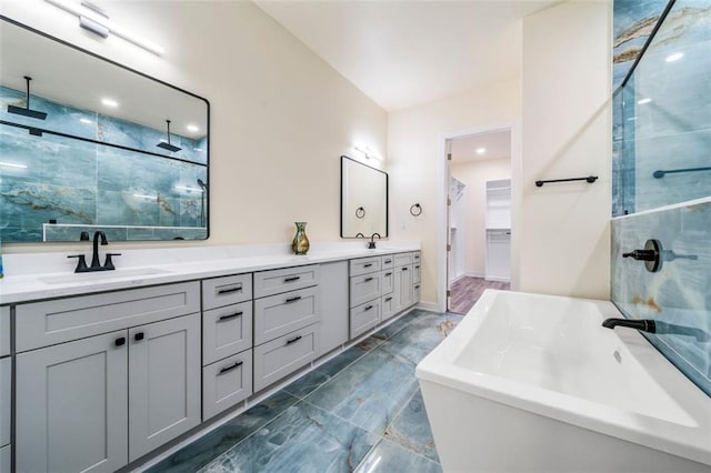 bathroom featuring vanity and separate shower and tub