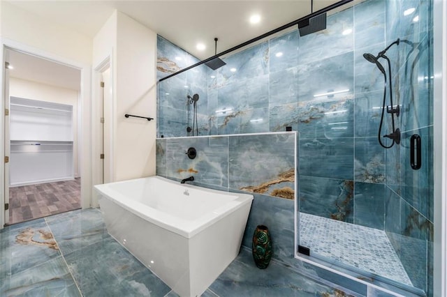 bathroom featuring plus walk in shower