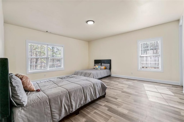 bedroom featuring light wood-type flooring