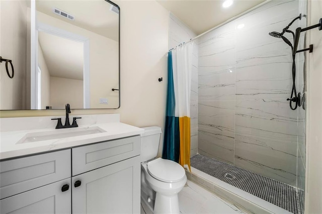 bathroom featuring vanity, toilet, and walk in shower