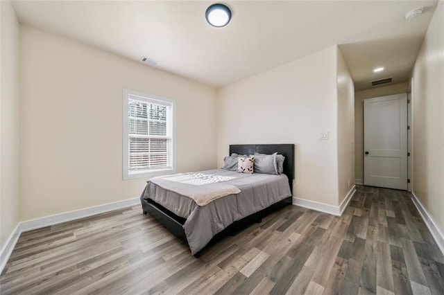 bedroom featuring hardwood / wood-style flooring