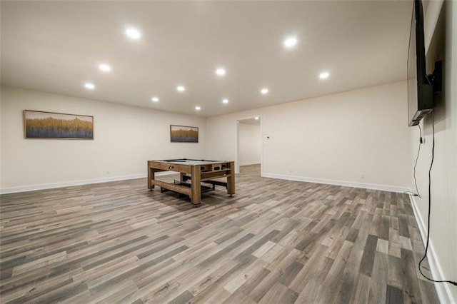 playroom with light hardwood / wood-style flooring