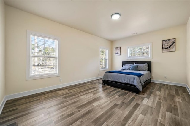 bedroom featuring dark hardwood / wood-style floors