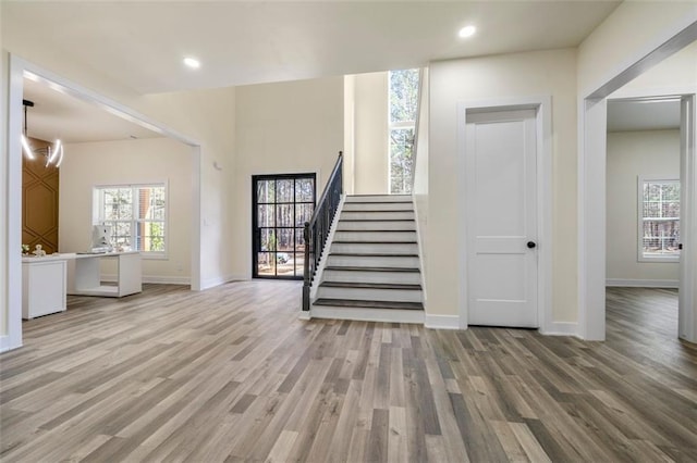 foyer entrance featuring a healthy amount of sunlight and light wood-type flooring