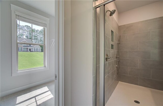 bathroom with a shower with shower door