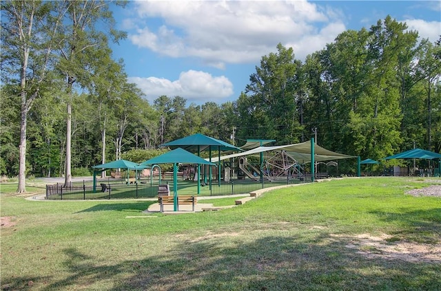 view of community with a lawn and a playground