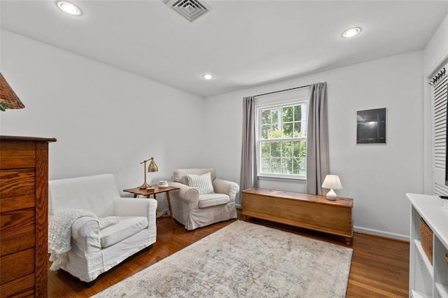 living area with wood finished floors, recessed lighting, and baseboards