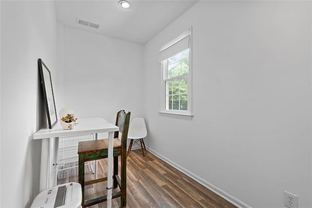 office space with baseboards and dark wood-style floors