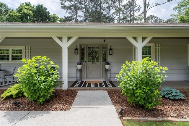 property entrance featuring a porch