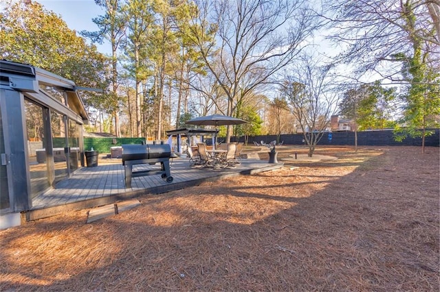 view of yard with a wooden deck