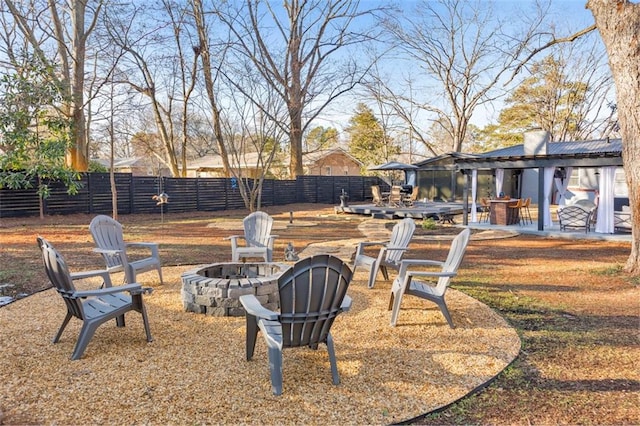 view of yard with a fire pit and a patio