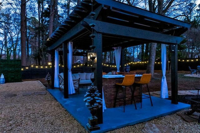 view of patio / terrace with area for grilling and an outdoor bar