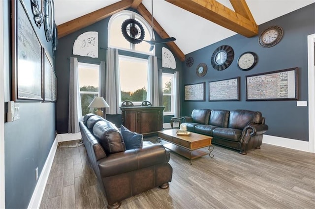 interior space featuring hardwood / wood-style flooring, high vaulted ceiling, and beam ceiling