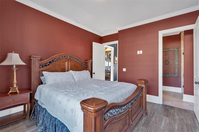 bedroom featuring ornamental molding and wood-type flooring