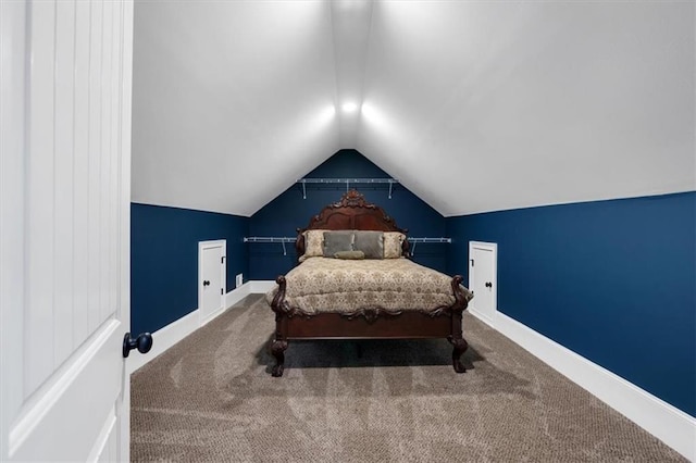 carpeted bedroom featuring vaulted ceiling