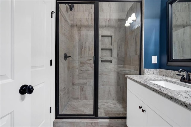 bathroom with vanity and an enclosed shower