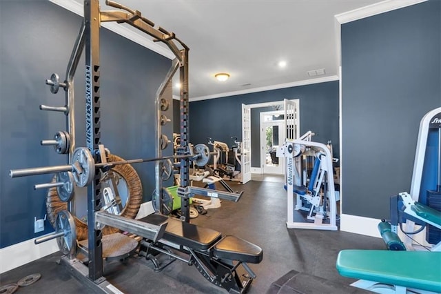 exercise room featuring crown molding