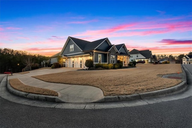 view of front facade featuring a lawn and a garage