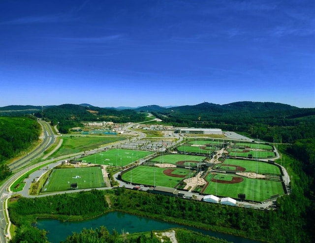 bird's eye view with a water and mountain view