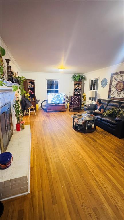 living room featuring a fireplace and hardwood / wood-style floors