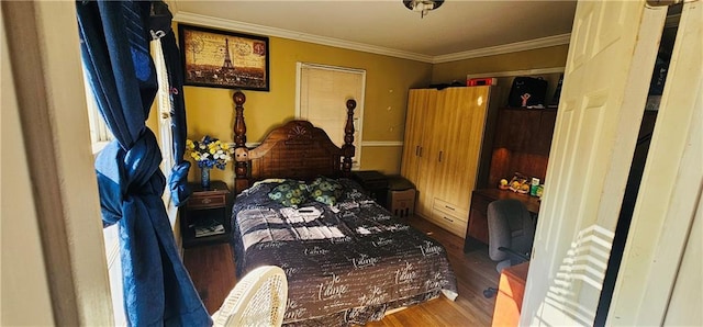 bedroom featuring wood-type flooring, crown molding, and multiple windows