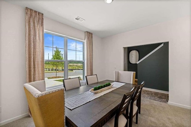 dining space with carpet flooring