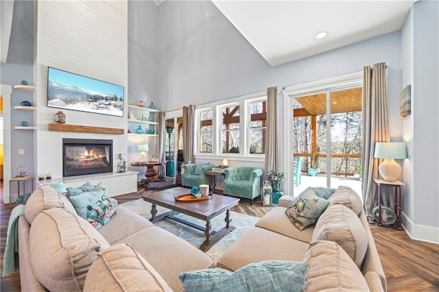 4115 Merritt Dr, Cumming, GA 30041 - living room with hardwood / wood-style flooring, a large fireplace, and a high ceiling