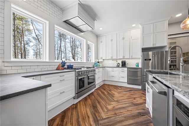 4115 Merritt Dr, Cumming, GA 30041 - kitchen with sink, white cabinetry, high quality appliances, dark parquet floors, and backsplash