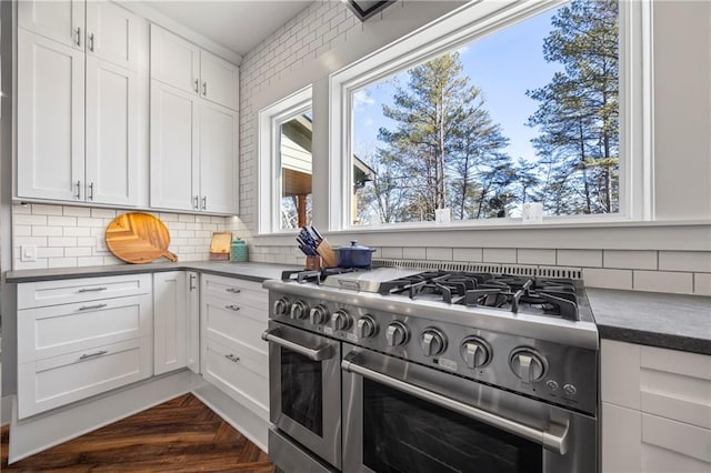 4115 Merritt Dr, Cumming, GA 30041 - kitchen with white cabinetry, double oven range, decorative backsplash, and dark parquet flooring