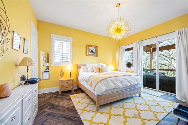 4115 Merritt Dr, Cumming, GA 30041 - bedroom with multiple windows, a notable chandelier, access to outside, and dark parquet floors