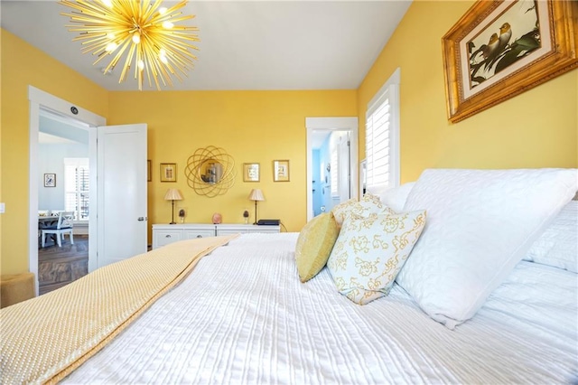 4115 Merritt Dr, Cumming, GA 30041 - bedroom featuring a chandelier