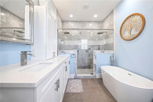 4115 Merritt Dr, Cumming, GA 30041 - bathroom featuring vanity, plus walk in shower, and tile patterned flooring