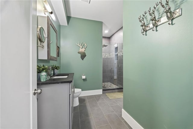 4115 Merritt Dr, Cumming, GA 30041 - bathroom featuring vanity, tile patterned floors, a shower with door, and toilet