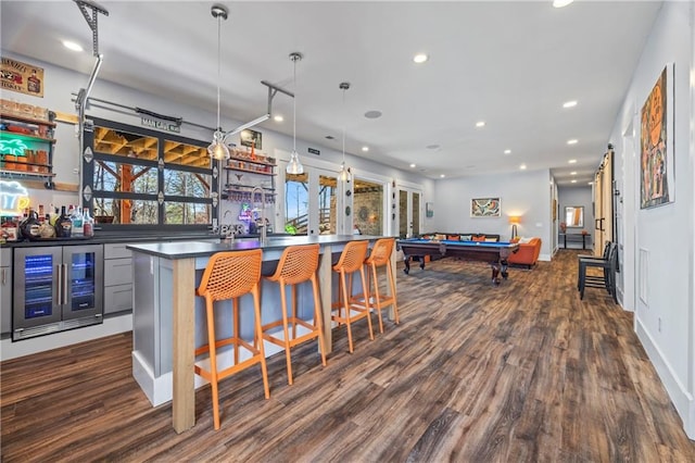 4115 Merritt Dr, Cumming, GA 30041 - bar featuring dark hardwood / wood-style floors, pendant lighting, beverage cooler, and billiards