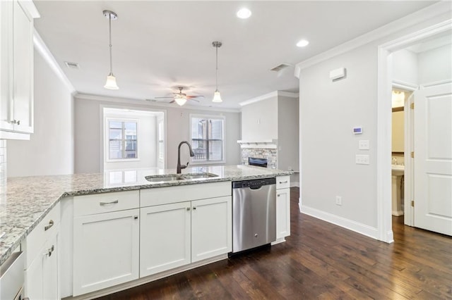 kitchen with white cabinetry, dishwasher, sink, and decorative light fixtures