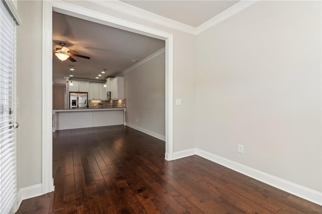 unfurnished living room featuring ornamental molding, dark hardwood / wood-style floors, and ceiling fan