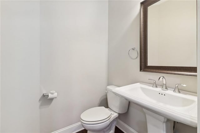 bathroom with toilet and sink