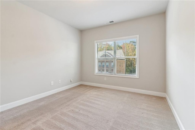 empty room with light colored carpet