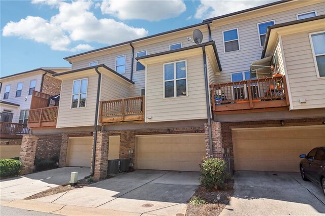 exterior space with a garage and a balcony